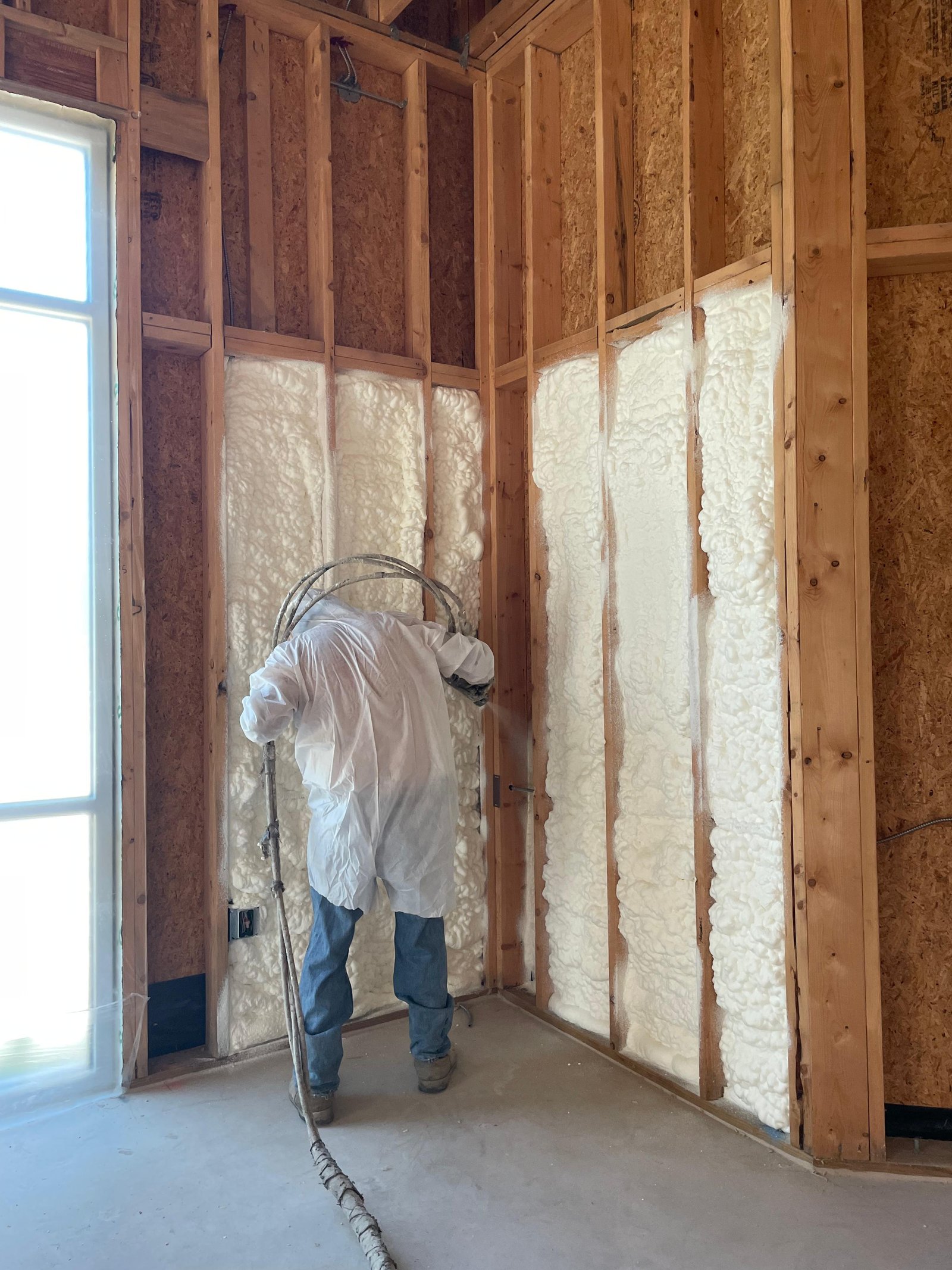 Spray foam insulation applied to walls and roof deck in San Antonio
